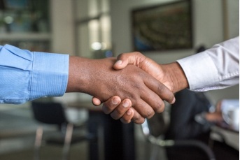 A handshake symbolizing a successful loan contract