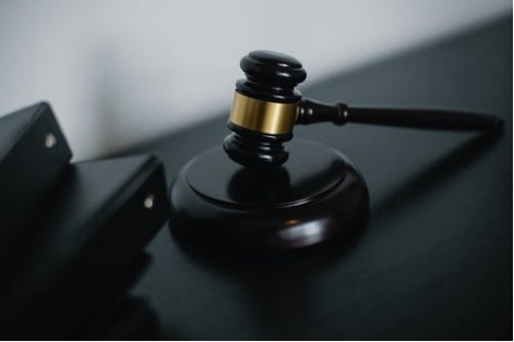 a black wooden gavel on a table