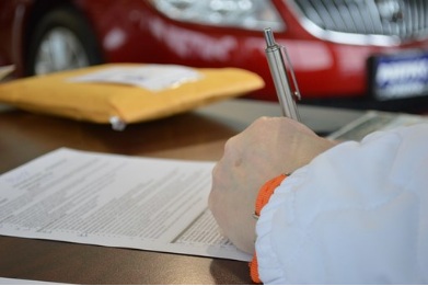 a man signing a loan agreement