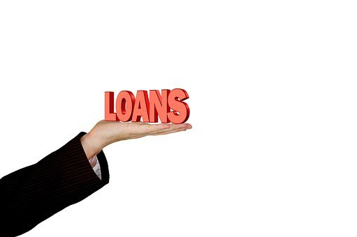 an illustration showing a person holding a word in hand that reads out loans