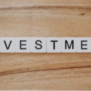 investment spelled out with scrabble tiles